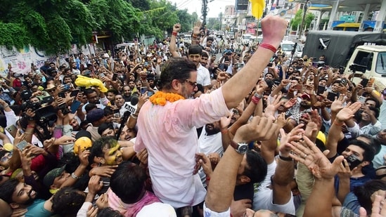 Jan Suraaj Party (JSP) founder Prashant Kishor celebrates with party workers during a victory march as he takes the lead in the Bankipur assembly bypoll result, in Patna on Monday.