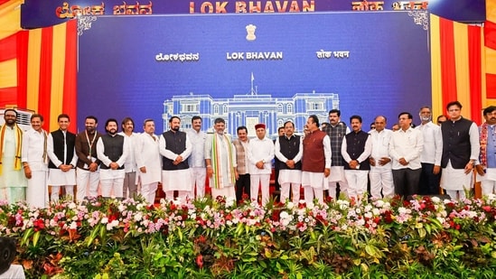 Karnataka Chief Minister DK Shivakumar in a group photograph with state Governor Thaawarchand Gehlot and newly inducted ministers during the Karnataka Cabinet expansion ceremony at Raj Bhavan in Bengaluru. (File Photo/ANI)