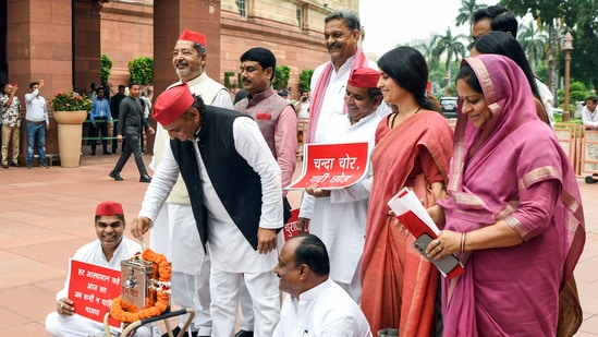 Parliament news highlights: Samajwadi Party National President Akhilesh Yadav, SP MP Dimple Yadav and other Opposition MPs stage a protest over the issue of alleged Ayodhya Ram Mandir donations embezzlement. Parliament news highlights: Samajwadi Party National President Akhilesh Yadav, SP MP Dimple Yadav and other Opposition MPs stage a protest over the issue of alleged Ayodhya Ram Mandir donations embezzlement.