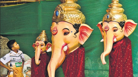 Mumbai, India – 28 June 2026: Children observe an Idol Lord Ganesh at a workshop at Lalbaug l, as begin for the upcoming Ganesh Festival, in Mumbai, India, on Sunday, 28 June 2026. (Photo by Bhushan Koyande/HT Photo)