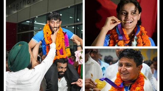 That’s how CWG stars received a warm welcome when they landed at Delhi’s IGI Airport. (Photos: PTI)