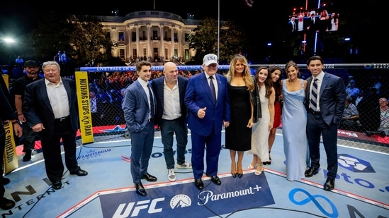 US President Donald Trump, first lady Melania Trump, UFC CEO Dana White and other guests pose inside the Octagon at UFC Freedom 250 on the South Lawn of the White House in Washington, DC.
