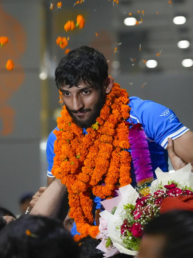 Judo gold medallist Harsh Singh received a hero’s welcome as family and friends carried him on their shoulders upon his arrival at IGI Airport. (Photo: Atul Yadav/PTI) Judo gold medallist Harsh Singh received a hero’s welcome as family and friends carried him on their shoulders upon his arrival at IGI Airport. (Photo: Atul Yadav/PTI)