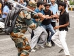 A security official carries out Lathi charge on protestors during their protest march towards Parliament called by Cockroach Janta Party, near Jantar Mantar in New Delhi.(ANI)