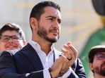 Michigan Democratic Senate primary winner Abdul El-Sayed claps during a press conference in front of the Spirit of Detroit statue on August 5 in Detroit, Michigan. (Getty Images via AFP)