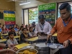 Following reports of small glass pieces being found in a mid-day meal at a BMC school in Ghatkopar on July 30, a BMC food safety medical officer visited the school to inspect the meal preparation and quality of food on Tuesday. As part of the inspection, the officer, along with school teachers, tasted the food before it was served to students, while also checking hygiene and food safety measures to reassure children and parents. (Satish Bate/Hindustan Times)