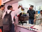 Self-help groups upcycle non-wearable donations into bags and decorative crafts sold at the Arpan Kendras.