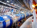 Some of the 1232 dipole magnets that bend the path of accelerated protons are pictured in the Large Hadron Collider in a tunnel of the European Organisation for Nuclear Research (CERN) in Echenevex, France. (AFP File)