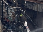 A firefighter rests at a site of a food warehouse hit by Russian missile strike, amid Russia's attack on Ukraine, in Kyiv, Ukraine August 5, 2026. Picture taken with a mobile phone. REUTERS/Stringer