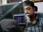 File photo: A broker reacts while trading at his computer terminal at a stock brokerage firm in Mumbai