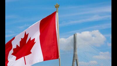 A Canadian flag flies near the Gordie Howe bridge connecting Windsor, Ontario, Canada, with Detroit, Michigan, US. (REUTERS) A Canadian flag flies near the Gordie Howe bridge connecting Windsor, Ontario, Canada, with Detroit, Michigan, US. (REUTERS)