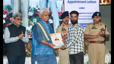 Jammu and Kashmir lieutenant governor Manoj Sinha hands over appointment letters for government jobs to the family members of terror victims at SKICC, in Srinagar on Wednesday. (ANI) Jammu and Kashmir lieutenant governor Manoj Sinha hands over appointment letters for government jobs to the family members of terror victims at SKICC, in Srinagar on Wednesday. (ANI)