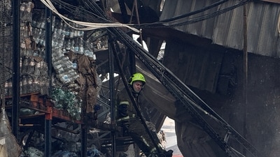 A firefighter rests at a site of a food warehouse hit by Russian missile strike, amid Russia's attack on Ukraine, in Kyiv, Ukraine August 5, 2026. Picture taken with a mobile phone. REUTERS/Stringer (REUTERS)