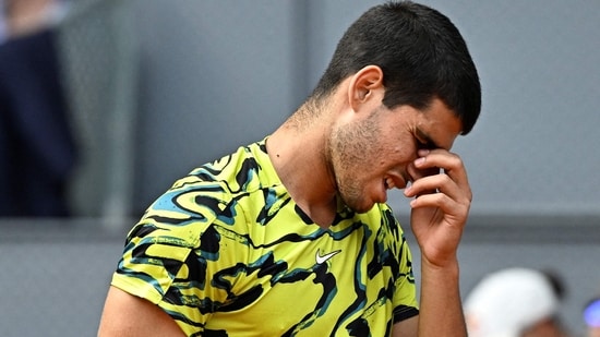 Carlos Alcaraz reacts during his 2023 ATP Tour Madrid Open tennis tournament.(AFP)