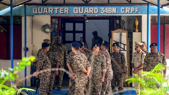 Security personnel stand outside the 34 Battalion camp after a CRPF officer shot his two colleagues dead and injured another before killing himself, at Katimari in Nagaon district, Assam, Tuesday, Aug. 4, 2026. (PTI)