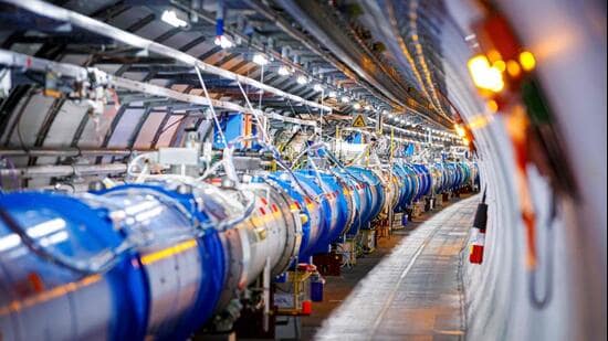 Some of the 1232 dipole magnets that bend the path of accelerated protons are pictured in the Large Hadron Collider in a tunnel of the European Organisation for Nuclear Research (CERN) in Echenevex, France. (AFP File)