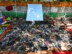 A young, good-natured man collected the hurriedly abandoned footwear from the July 20 protest march the next morning (Vipin Kumar/Hindustan Times)