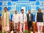 Karnataka Governor Thaawarchand Gehlot with state Chief Minister DK Shivakumar and Deputy Chief Minister G Parameshwara during the Karnataka Cabinet expansion ceremony at Raj Bhavan