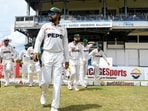 Babar Azam (C) of Pakistan leads his teammates on to the field during the 1st day of the 2nd Test match between West Indies and Pakistan at Queens Park Oval(AFP)
