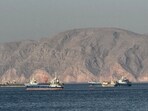 Oil held losses after Iran announced the agreement, raising the prospect of more energy flows resuming through the strait.