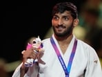 India's Harsh Singh poses with his gold medal in the men's 60kg judo at the Commonwealth Games in Glasgow. (AP Photo)