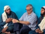 Jammu and Kashmir chief minister Omar Abdullah meets and offers condolences to a family who lost eight family members in cloudburst-triggered flash floods and landslides, at Murrah village in Surankote sector of Poonch district, on Wednesday. (PTI)