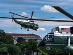 Marine One, left, with President Donald Trump aboard, lifts off from the Ellipse(AP Photo/Alex Brandon)