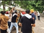 Onlookers assisting police in rescue efforts following the mishap near Rial Majri village on the Patiala-Bhadson road on Wednesday morning. (HT)