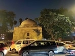 The pale walls were catching just enough light from two street lamps to remind the passing commuters that Gol Gumbad was still there.
