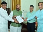 UP higher education minister Yogendra Upadhyay (second from left) handing over letter of permission to private universities (Sourced)