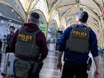 Immigration and Customs Enforcement agents patrol Ronald Reagan Washington National Airport.