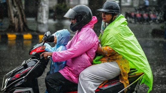 Gram it: Rains can't stop Delhiites from stepping out to reach their destination. Here's how a family of three rides on a two-wheeler while covered with raincoats. The weather department has issued a forecast of heavy to moderate rain for today as well, from early morning to noon.