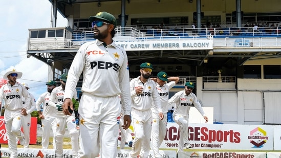 Babar Azam (C) of Pakistan leads his teammates on to the field during the 1st day of the 2nd Test match between West Indies and Pakistan at Queens Park Oval