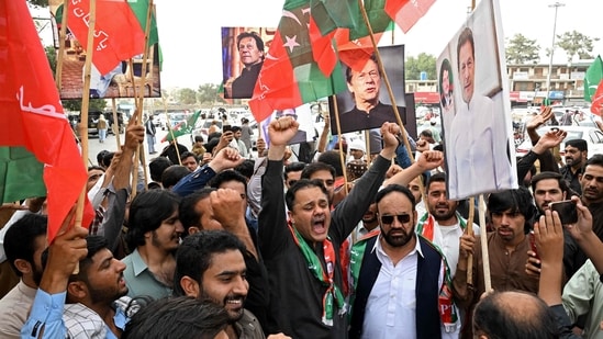 Pakistan Tehreek-e-Insaf (PTI) party supporters hold portraits of their jailed leader and the country's former Prime Minister Imran Khan during a protest demanding his release, in Quetta on August 5, 2026.
