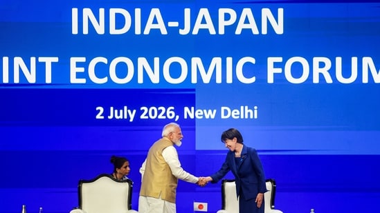 Prime Minister Narendra Modi greets Japanese Prime Minister Sanae Takaichi during the India-Japan Joint Economic Forum, in New Delhi.