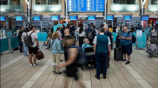 Travellers wait at the check-in at Vancouver International Airport in Richmond, British Columbia (Photograph for representative purpose only) (AP)
