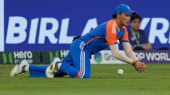 Abhishek Sharma dropping a catch in Indian colours.