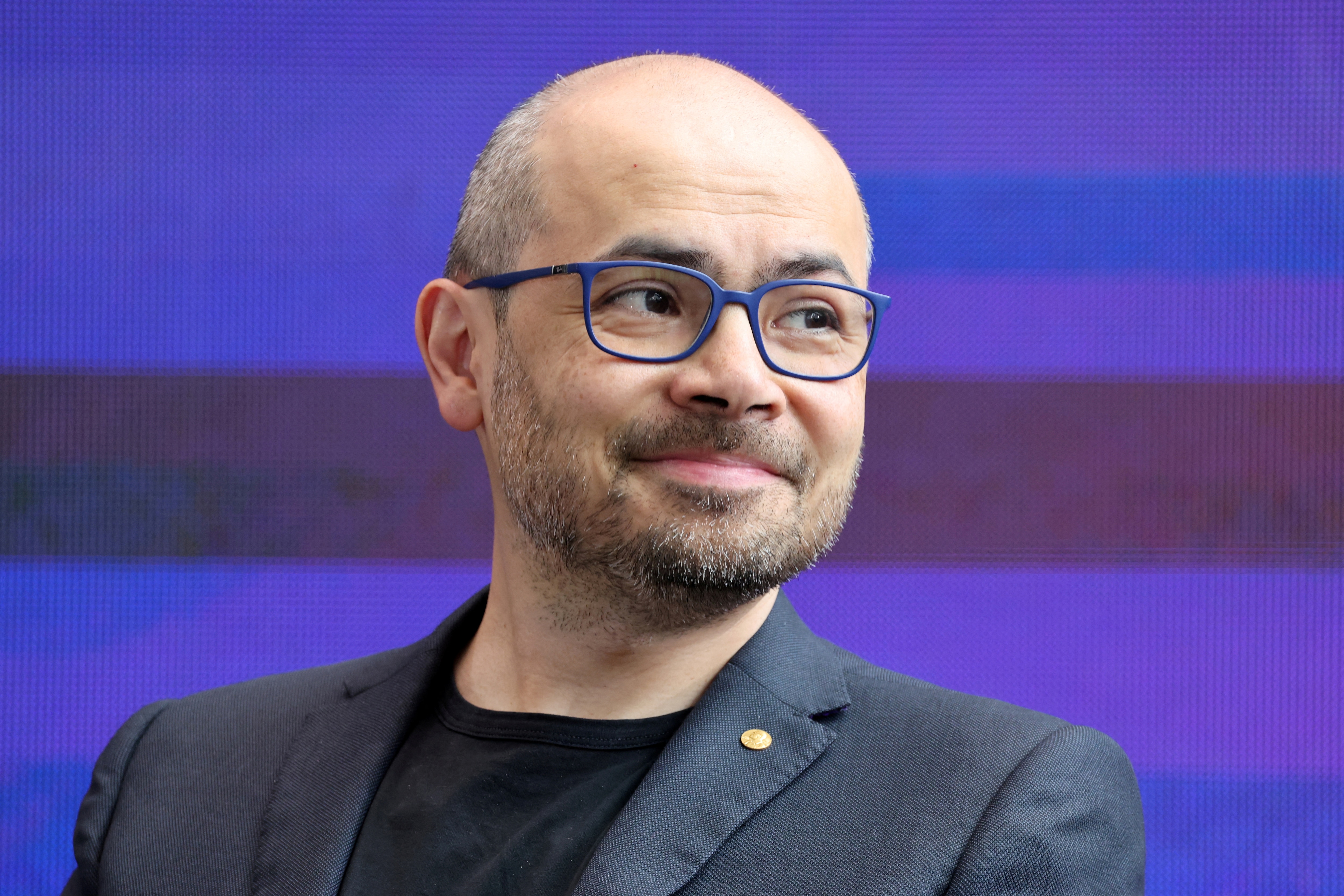 Demis Hassabis listens during a debate at an AI summit at Imperial College London. (Reuters File)