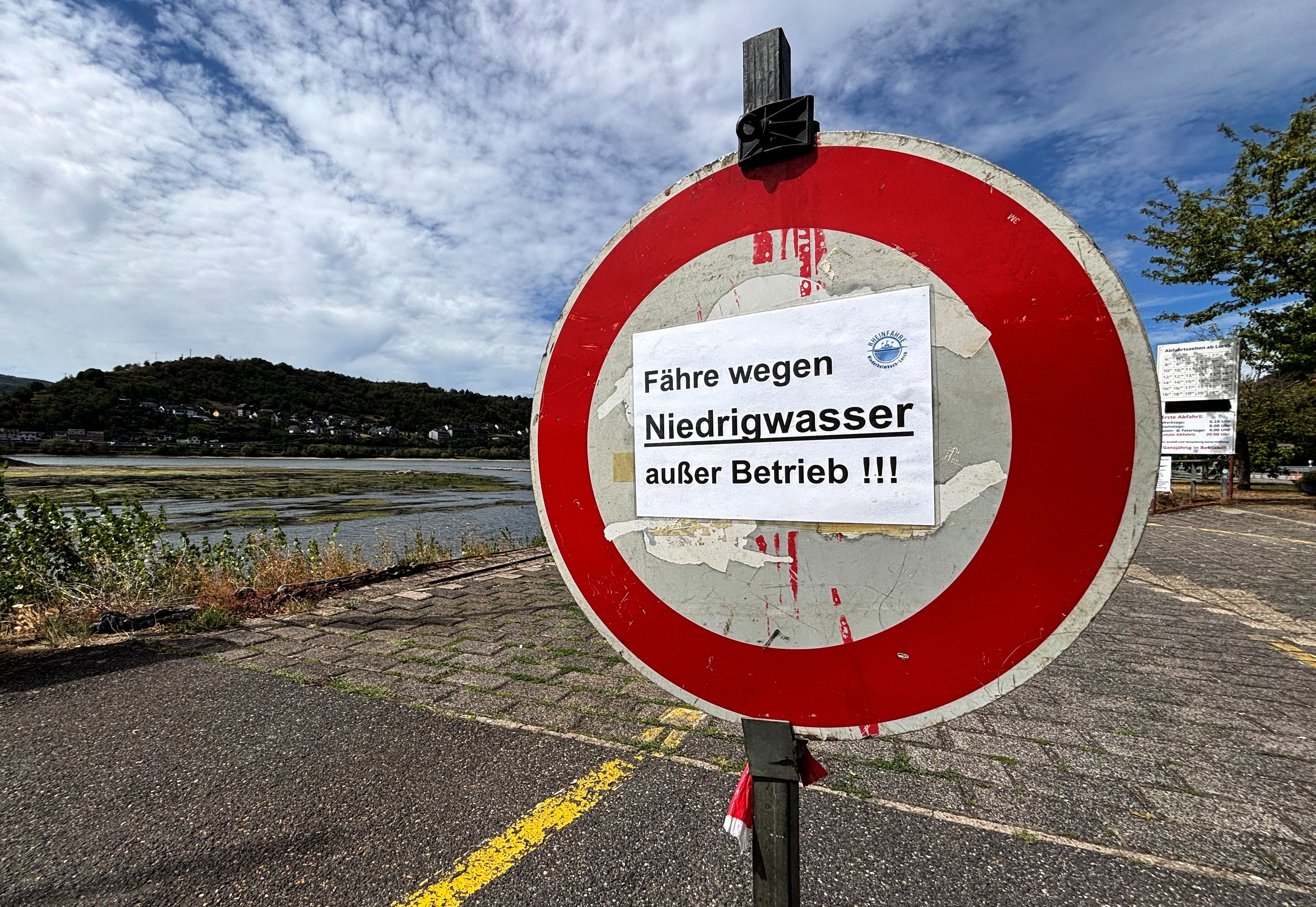A sign on a Rhine ferry reads "Ferry suspended due to low water levels" during prolonged dry weather across Europe, which is causing massive consequences for German industry, in Kaub, Germany, (REUTERS)