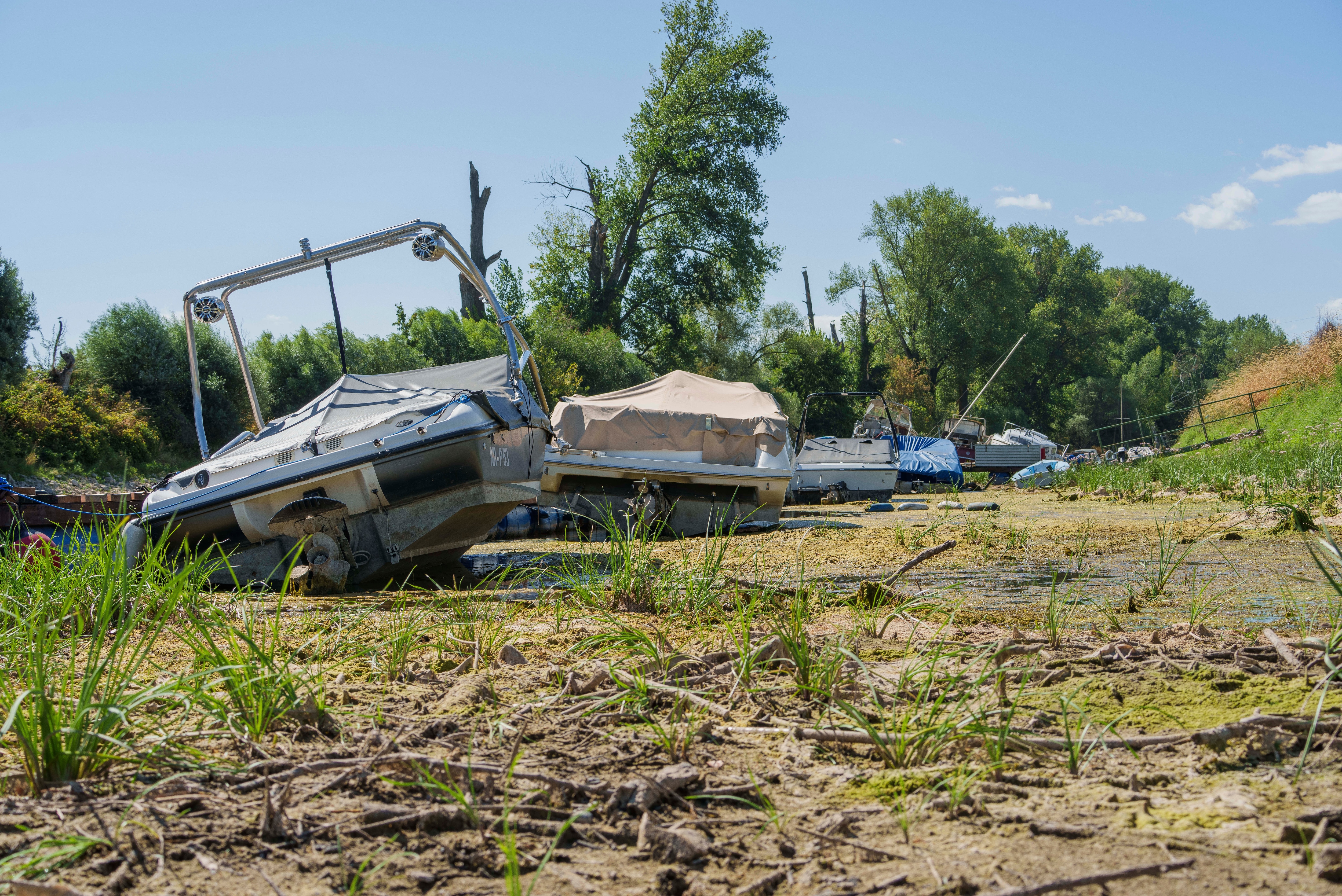 Recreational boats lie aground in the nearly dry Mühlarm, a side channel of the Rhine, amid low water levels in Nackenheim, Germany, (Andreas Arnold/DPA via AP) Recreational boats lie aground in the nearly dry Mühlarm, a side channel of the Rhine, amid low water levels in Nackenheim, Germany, (Andreas Arnold/DPA via AP)