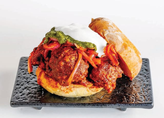 So far there’s only one really delicious Indian fried chicken sandwich: The Rowdy Rooster in New York. (THE ROWDY ROOSTER) So far there’s only one really delicious Indian fried chicken sandwich: The Rowdy Rooster in New York. (THE ROWDY ROOSTER)