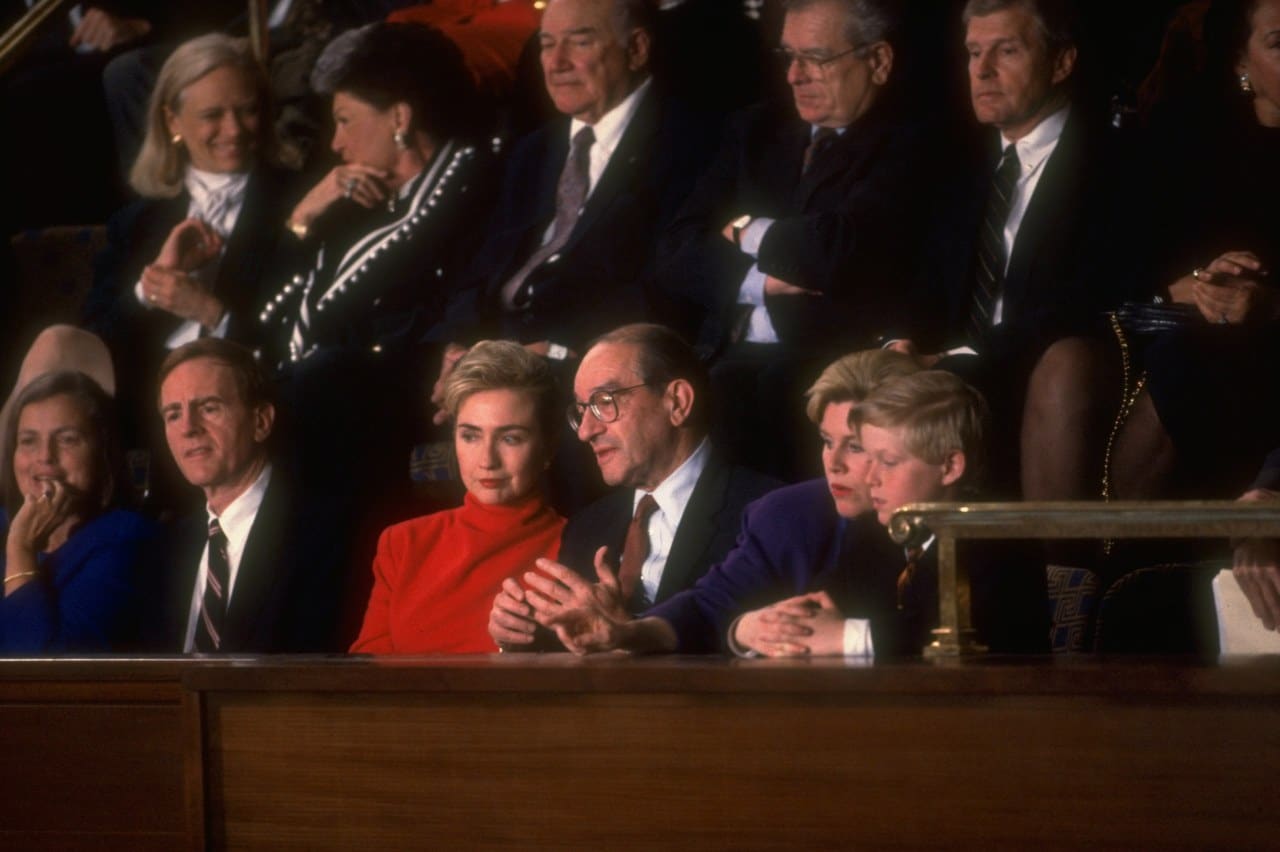 Hillary Clinton, in red, sitting with Fed Chairman Alan Greenspan on her left at President Bill Clinton’s first joint address to Congress in 1993. Hillary Clinton, in red, sitting with Fed Chairman Alan Greenspan on her left at President Bill Clinton’s first joint address to Congress in 1993.