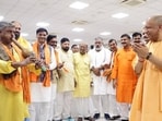 Chief minister Yogi Adityanath with members of the denotified and nomadic communities during a programme organised to thank the Uttar Pradesh government for constituting the Nomadic Development Board, in Lucknow on Thursday (HT PHOTO)