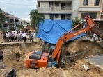 MC workers repair work on road cave-in, in Kitchlu Nagar area Ludhiana on Friday. (Gurpreet Singh/HT)