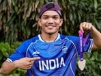 Boxing silver medallist Jadumani Singh Mandengbam poses during a felicitation ceremony. (PTI)