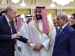 Turkey's President Recep Tayyip Erdogan (L), Saudi Arabia's Crown Prince Mohammed bin Salman (C) and Pakistan's Prime Minister Shehbaz Sharif meeting in Mecca.