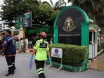 People, including emergency personnel, gather outside Debsirin Nonthaburi School, the site of a shooting incident, in Bang Kruai district in Nonthaburi province on the outskirts of Bangkok