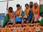 The procession ended at the Sarv Jatiya Jatu Khap platform, where the two boxers were felicitated by local organisations and village elders. (HT PHOTO)