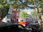 An ambulance is parked outside the home of Senator Mitch McConnell as police and fire vehicles block the street on the morning when he was reported to have been taken to the hospital in Washington, D.C., on June 14, 2026. 