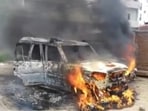 Visuals showed several vehicles on fire and policemen attempting to control the situation.(ANI video grab)